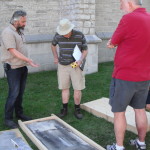 Alex Gabov examining a tombstone in Kingston's Lower Burial Ground